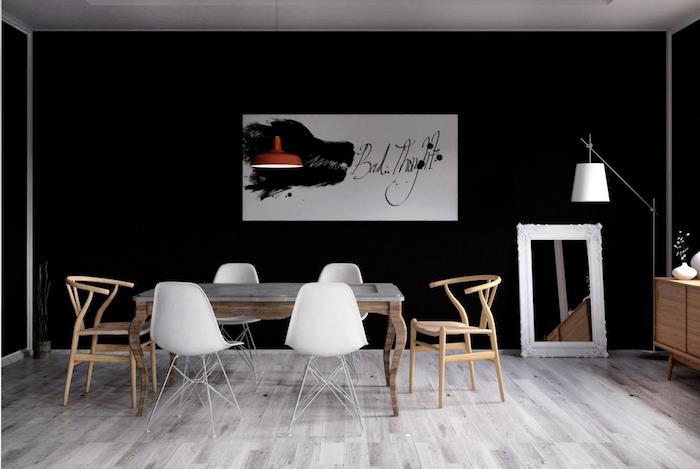 sodobna jedilnica v skandinavskem slogu s črnimi stenami in lesenim dizajnerskim pohištvom v rustikalnem slogu
