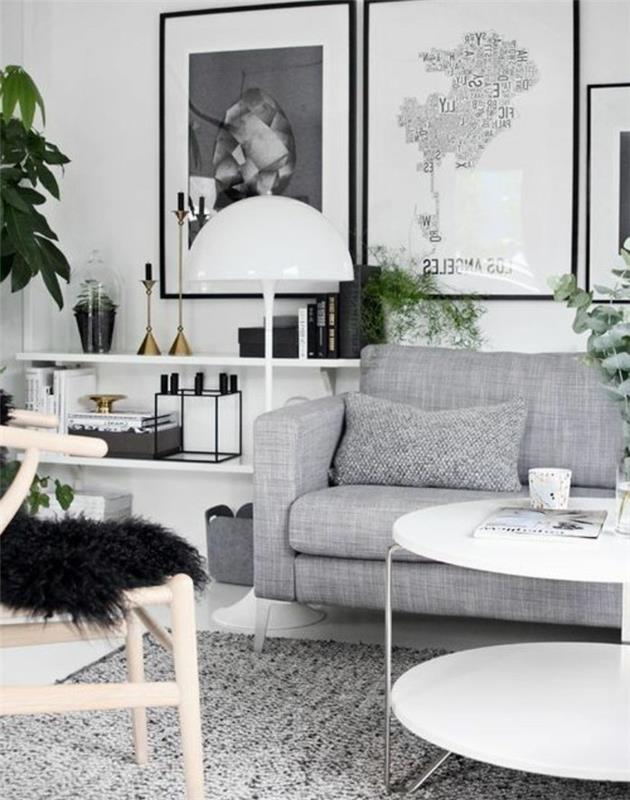 Idea per arredare salotto piccolo, divano di colore grigio, tavolino rotondo di colore bianco