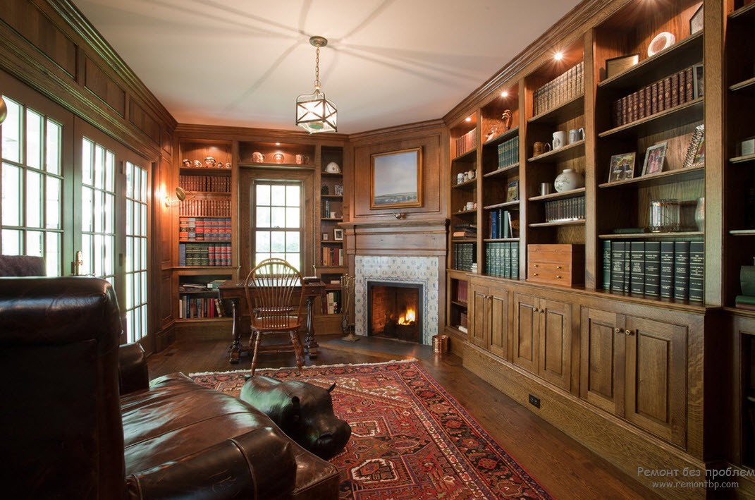 Espectacular diseño de una sala de estar clásica con chimenea y biblioteca.