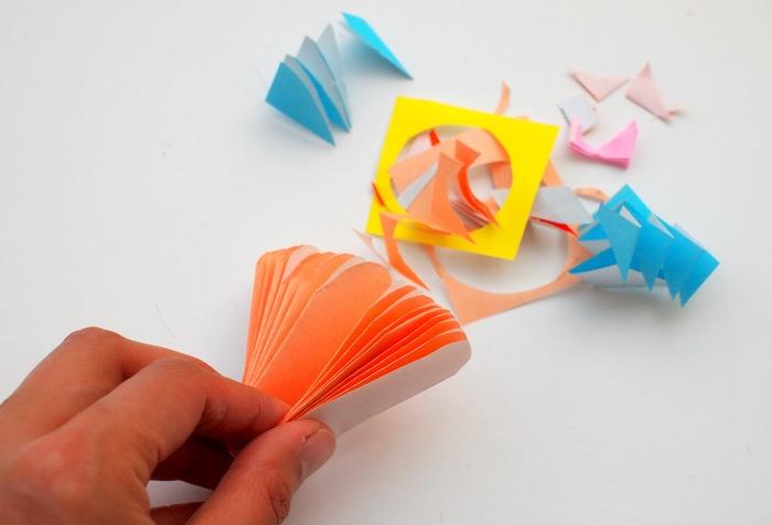 renkli kağıt çiçek yapmak için kağıt parçalarını kes, çocuklar için kolay, yaratıcı kendin yap fikri