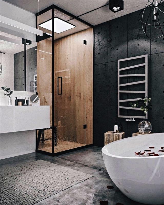 leseni tuš prostor, omejen z minimalistično stekleno steno v sodobni kopalnici v beli in črni barvi
