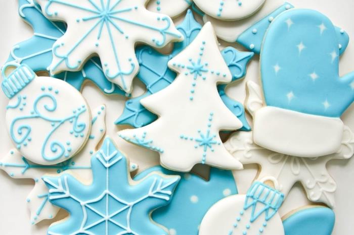 enostavna kulinarična umetnost za božič, kako okrasiti alzaški bredele z modro -belo glazuro z vzorci jelke in božičnih snežink
