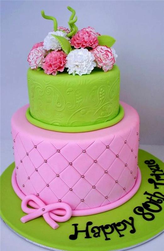dviejų pakopų rožinės ir žalios spalvos tortas, gražus kūrybos tortas, papuoštas gėlėmis ir suasmenintas