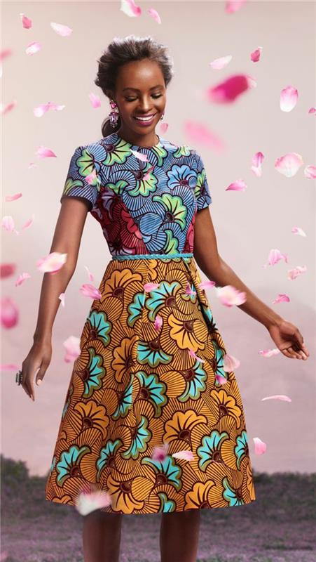 Stoffe africane con motivi floreali, ragazza con abito colorata, bir ruota olacak