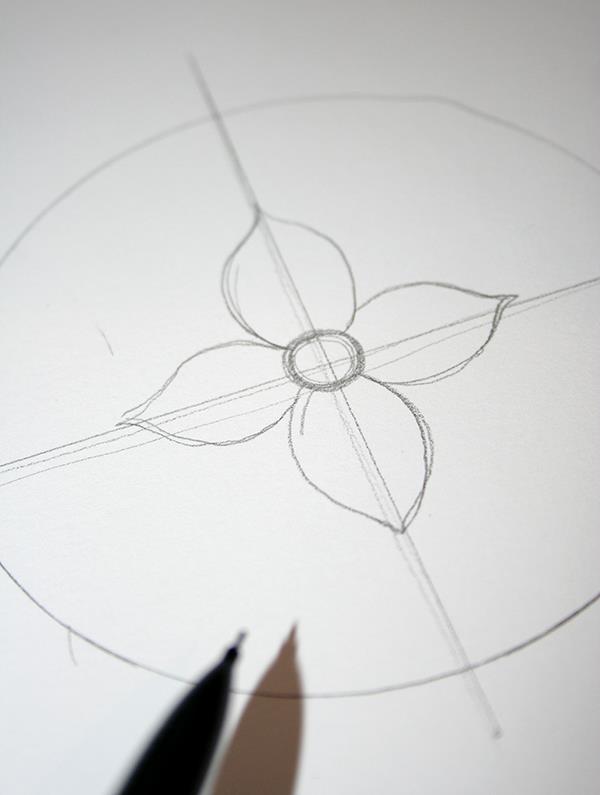 zanaat fikirleri, beyaz kağıt üzerine kurşun kalemle çizilmiş daire, iki kesişen çizgi ve ortasında bir çiçek