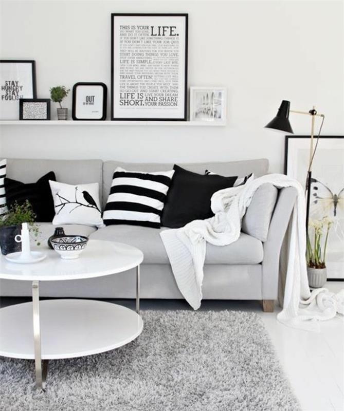 įrėmintas menas ,, ant kabančios lentynos, baltas kavos staliukas, šviesiai pilka sofa, kokios spalvos dera su pilka