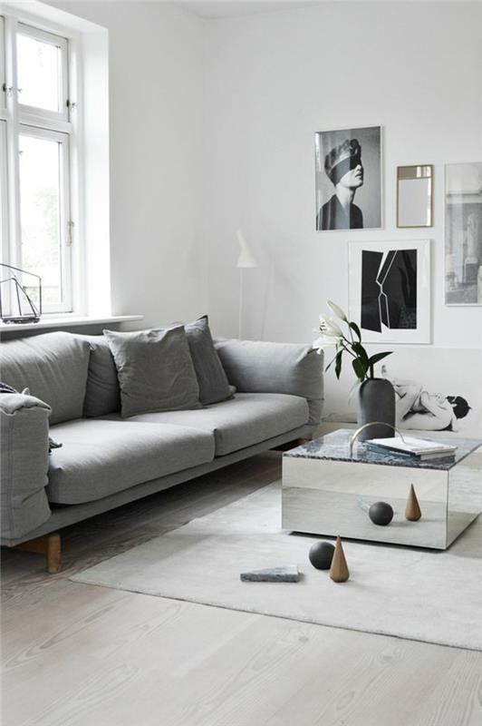 gyvenamojo kambario deko idėja, kvadratinis stalo metalinis apdaila, meniškas portretas, vintažinė skandinaviško stiliaus sofa