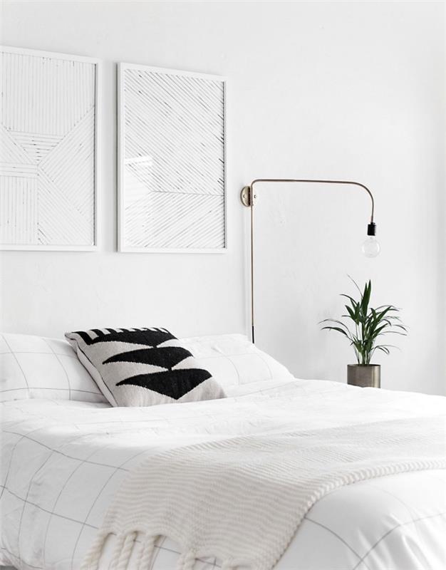 beyaz bir İskandinav yatak odasının nasıl dekore edileceğine dair fikir, gri ve siyah kuzen vurgusu, beyaz yatak çarşafları, ilginç lamba, yeşil bitki
