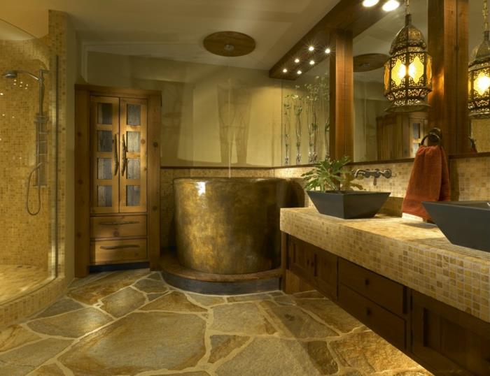 vonios idėja, natūralaus akmens grindys, apvali vonia, mozaikinis stalviršis, juodos spalvos kriauklės
