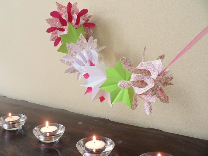idėja lengvai pasidaryti „pasidaryk pats“ origami pavasarį, graži girlianda, sudaryta iš origami gėlių ir reljefinių gėlių