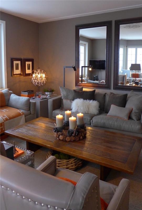 sıcak oturma odası taupe gri deri kanepeler ve kahverengi ahşap masa