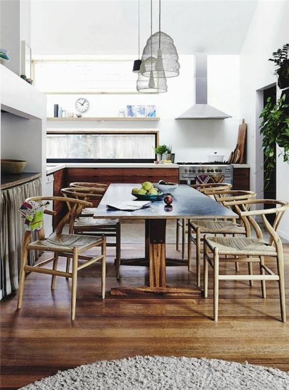 Saloni modern e un'idea per arredare la sala da pranzo con un tavolo di legno e sedie in rotango