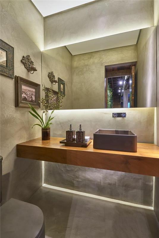majhna kopalniška dekoracija, zen in topla kopalnica, viseča omara za umivalnik v kvadratnem umivalniku iz bež lesa v črnem kamnu