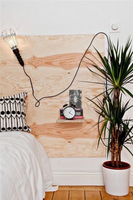 naredite vzglavje iz lahke lesene deske, bele posteljnine in blamc ter črne blazine, rastline, palme, skandinavski dekor spalnice