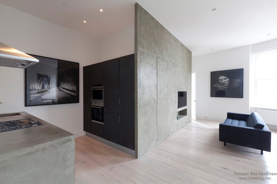 Design suave e menos contrastante de uma cozinha em preto e branco combinada com uma sala de estar