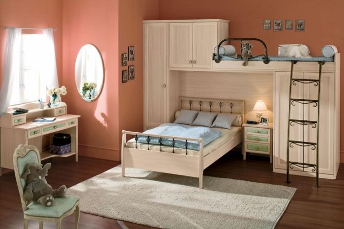 lepa otroška spalnica, svetlo siva preproga, ovalno ogledalo, bela miza, otroška knjižna omara