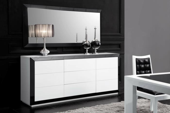 interjeras-balta-juoda-pilka-kilimas-svetainėje-su kėdute ir virtuvės stalu