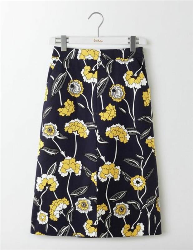A formos sijonai su ilgomis geltonomis gėlėmis išryškina siluetą