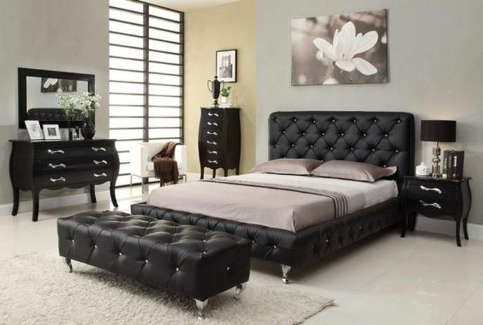 tasarım-yatak-180x200-siyah-deri-yatak-bej-halı-yatak odasında-küçük-siyah-ahşap-mobilya