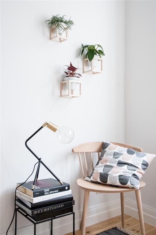 ahşap ve beyaz bir odada minimalist ruhun modern iç tasarımı, duvarda asılı bitki fikri