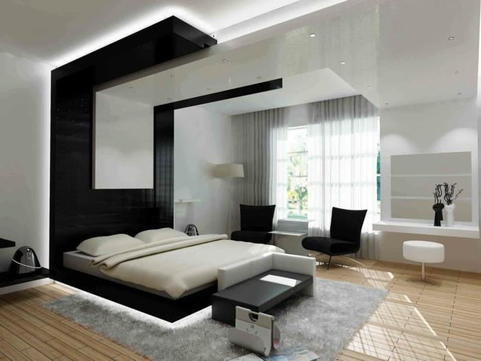 šviesus po lova-pilkas kilimas-šviesaus medžio parketas-langas-didelės užuolaidos-pilkai juodos kėdės