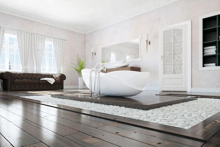 Zen dekoru için zeminde kahverengi detaylar ve taşlarla güzel beyaz banyo, sakin ve düzenli Zen banyo
