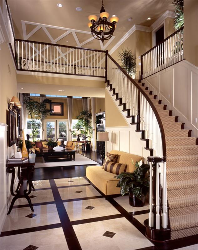ustvarite elegantno dekoracijo vhoda v luksuzni hiši, veliko stopnišče, lesena konzola, črno -bele ploščice, bež kavč, ustvarite vhod na odprtem prostoru