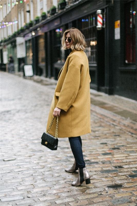 ženski model plašča zima 2020 v rumeni barvi z veliko velikostjo z žepom, eleganten ženski videz v kavbojkah in visokih čevljih