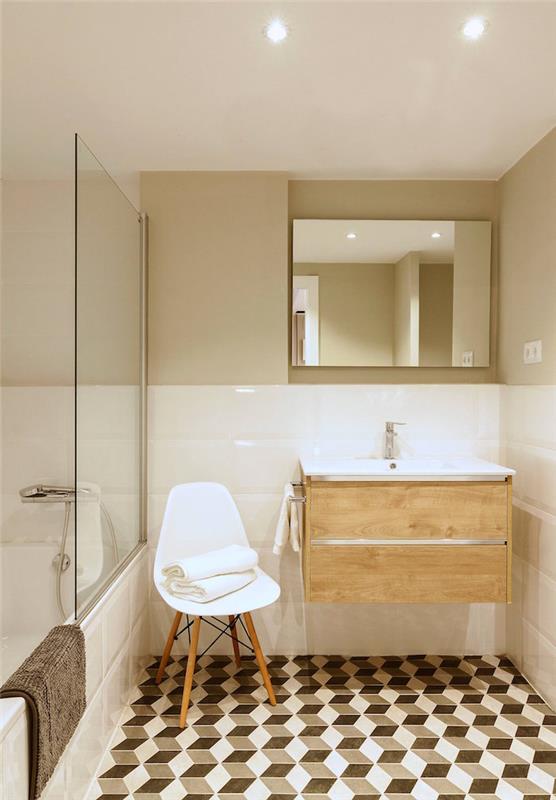 primer majhne kopalnice z retro dekorjem v skandinavskem slogu s ploščicami 3d efekta beli vintage stol in sijoče bele ploščice na steni