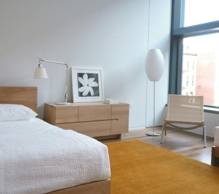 skandinaviški baldai-idėja-kaip papuošti miegamąjį-medinius baldus-geltonai-kilimas-spalva-balta-siena
