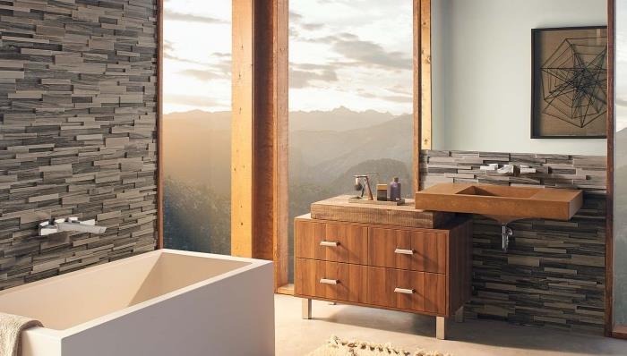 sodoben načrt kopalnice z velikim oknom in kamnito steno, omaricami iz rjavega lesa