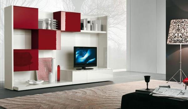 baltai lakuotos televizoriaus spintelės ir raudonos komodos