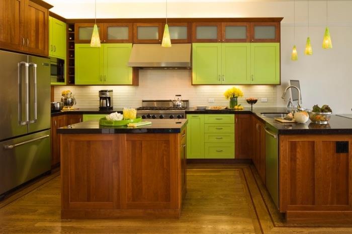 Razpored kuhinje v obliki črke U z otokom, kuhinjski model z belimi stenami z rjavim lesenim pohištvom in zelenimi omarami