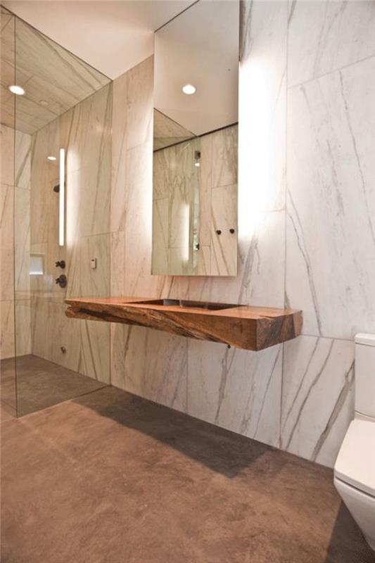 veidrodį apšviečiantis vonios kambarys-vonios kambarys-baltu marmuru išklotas vonios kambarys