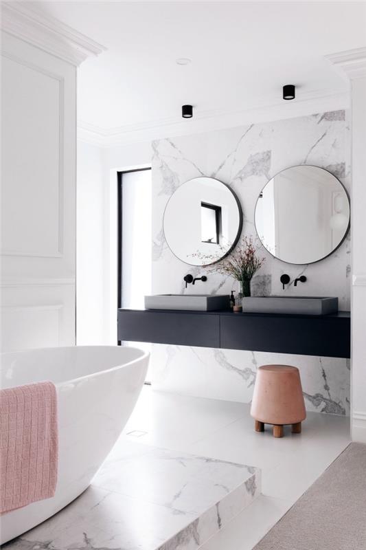 mat siyah banyo lavabo dolabı, beyaz duvar boyası ve kısmi mermer kaplama ile şık iç tasarım