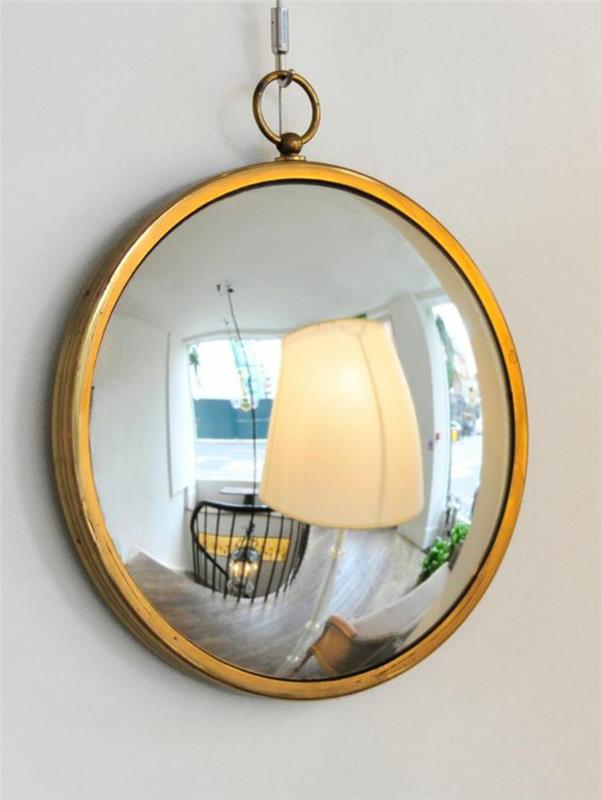 raganos veidrodis su aukso rėmo raštu senas laikrodžio kirpėjo veidrodis