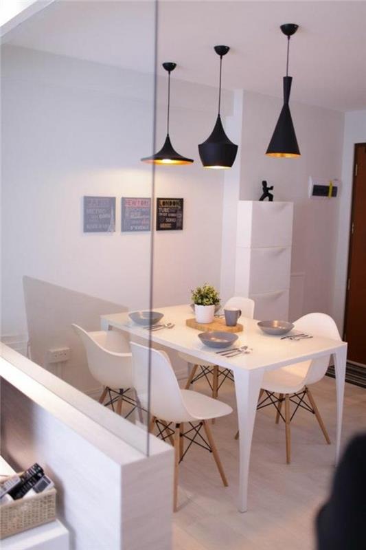 Sala da pranzo moderna e un'idea per la decorazione del tavolo con un centrotavola di legno