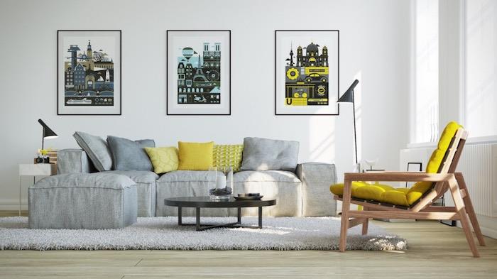 inci grisi ile hangi renk uyumlu olur, reklam afişleriyle süslenmiş beyaz duvar, gri halı ve kanepe, sarı minderli ahşap sandalye, açık renkli parke