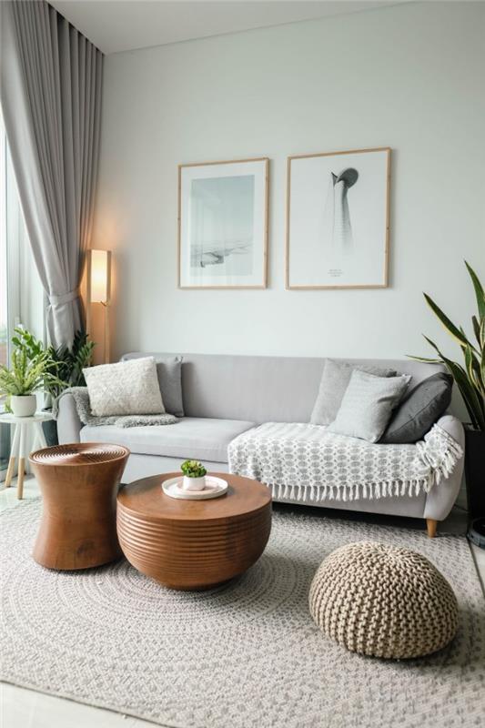 sivo -beli dekor dnevne sobe v skandinavskem slogu z bakreno mizo na sredini, ki združuje ideje za dnevno sobo