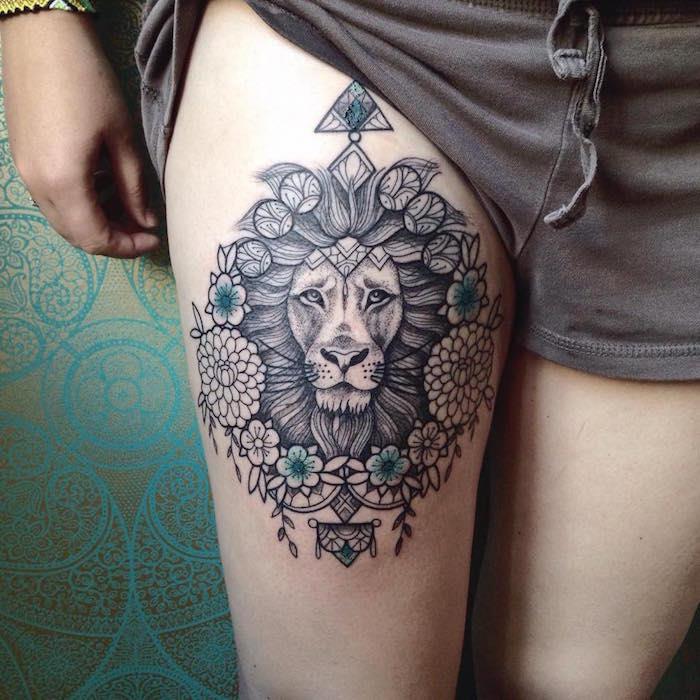 Liūto galvos šlaunies šlaunies tatuiruotės idėjos