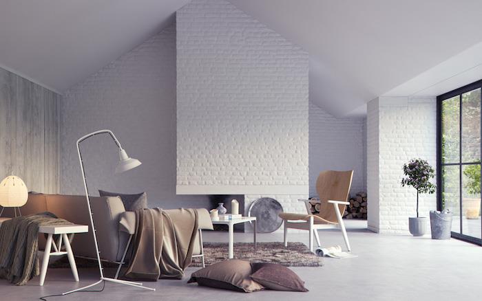gri, kanepe, gri halı ve minderlerle renk kombinasyonu, gri beton efektli zemin, beyaz tuğla vurgulu duvar, ahşap sandalye, beyaz sehpa, İskandinav tasarımı