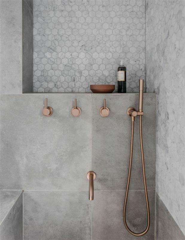 Zen banyo dekoru, zen banyo fikirleri, küçük modern banyo, gri kumtaşı duvarlar, bronz renkli lavabolar, pastel gri arı kovanı desenlerinde duvar