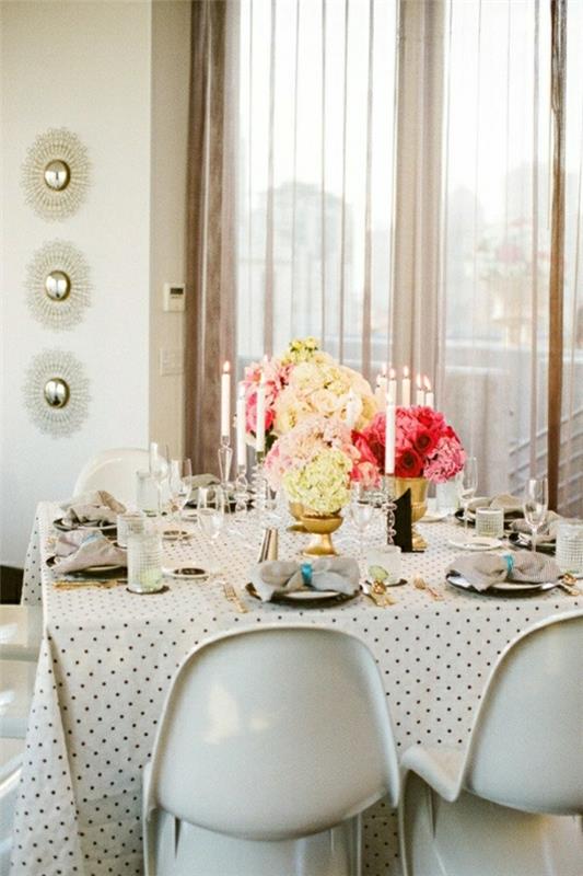 staltiesė-vaškuota-stalo gėlės-elegantiškas-stalo-žvakės-baltos-kėdės