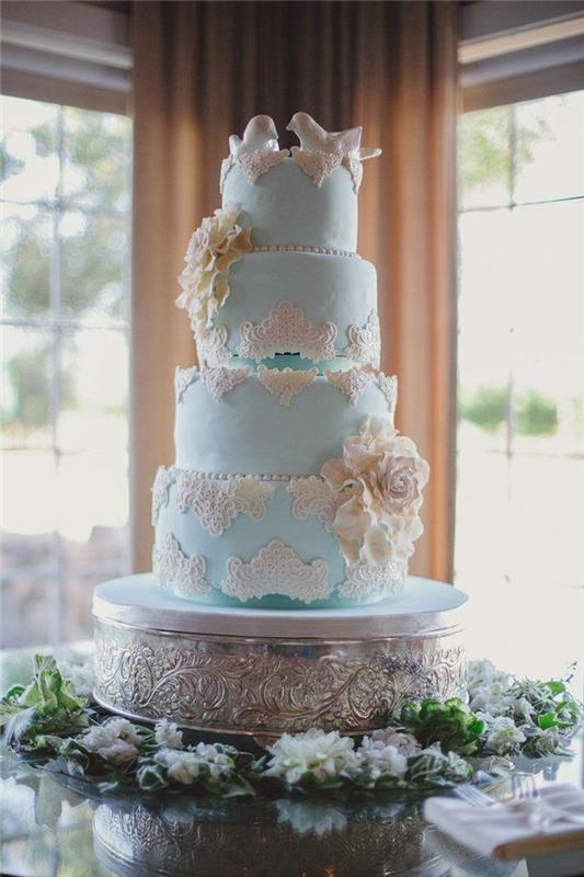 Vestuvinis tortas, romantiška meilė, balta paukščio figūrėlė ir mėlynas vestuvių tortas, originalus vestuvinis tortas