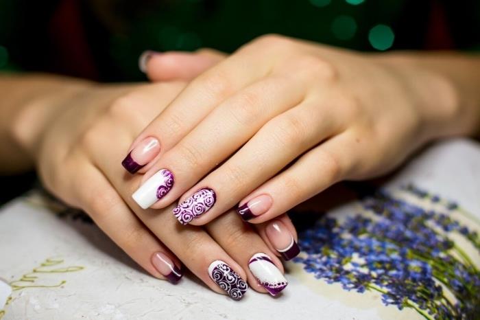 ultra vijolična barva kot trendovska francoska oblikovalska manikura, nail art v beli in vijolični barvi s cvetličnim okrasjem