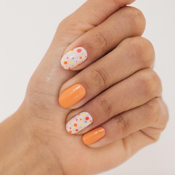 Gel nail deco, ideja za manikuro z gel lakom, model nohtov art, ženska lepota, oranžna in bela pika na i z mazilom