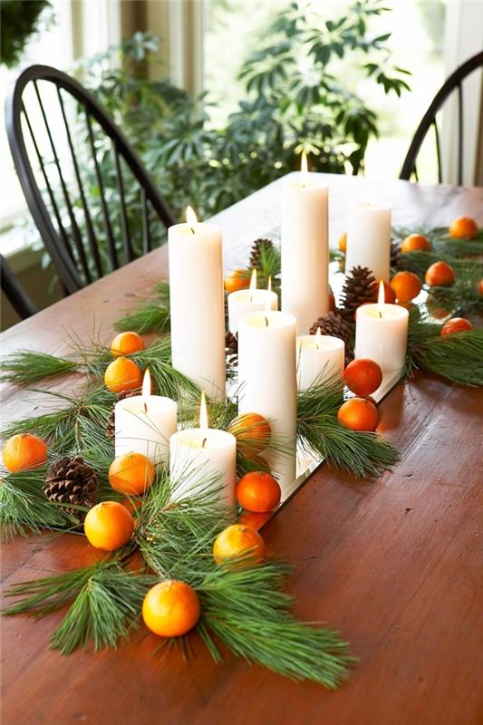 pomaranče borovci v središču božič DIY bele sveče zelene veje božičnega drevesa