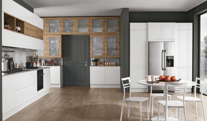 sodoben dekor v kuhinji v sivi beli barvi in ​​lesu z jedilnico in velikim oknom