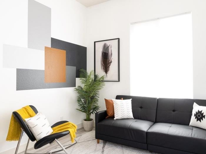 geometrijsko slikarstvo dnevna soba moderna dekoracija postavitev dnevne sobe črn gumb na kavč bela blazina črni stol rumeni met