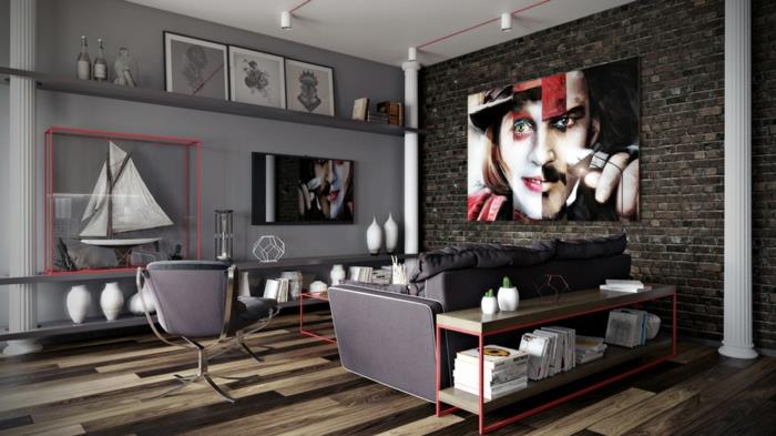 anglies pilka svetainės kambario spalva, pilka sofa, didelis ekstravagantiškas portretas, sieninės lentynos